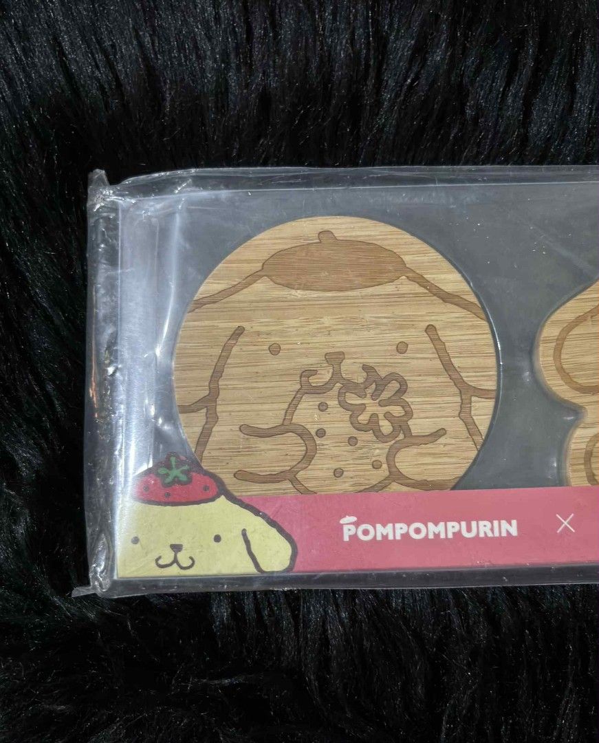 New Pompompurin x McCafe Wooden Coasters (Category: Other Kitchenware & Tableware) located in Manila. Submitted by dallecloset_ii (Listing ID 1404051689, Image 3). Description: Set of two Pompompurin x McCafe wooden coasters. Brand new, still sealed. Features engraved designs on light brown wood..