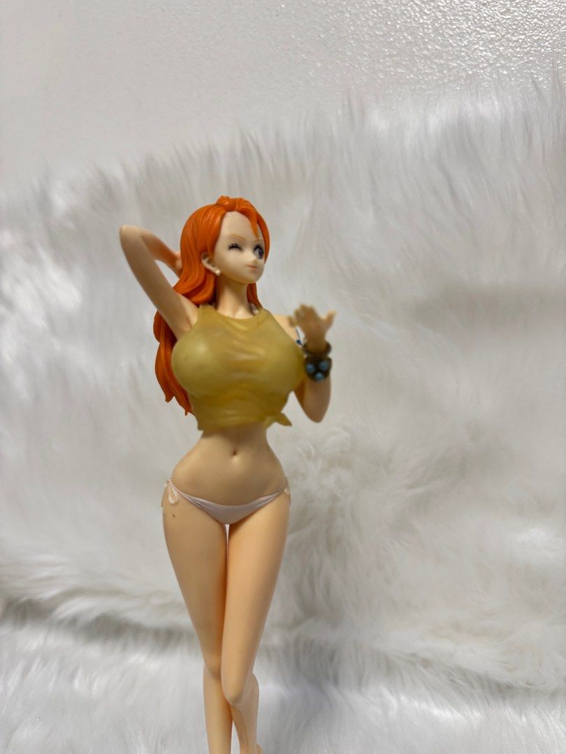 One Piece Nami Figure (Category: Figurines & Statues) located in Paranaque City. Submitted by wolf5037 (Listing ID 1404005669, Image 2). Description: - One Piece Nami figure - Features Nami in a bikini and top - Orange hair and dynamic pose - Includes a display base - Highly detailed and well-crafted - Perfect for One Piece collectors.