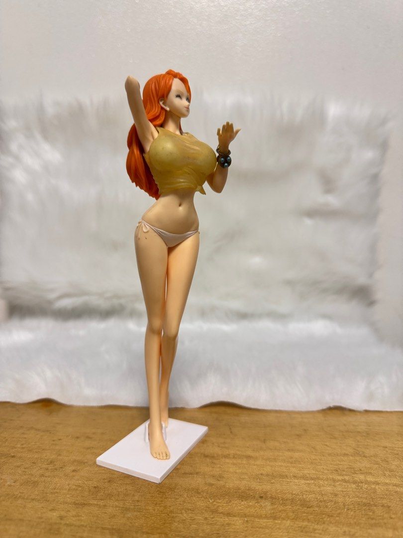 One Piece Nami Figure (Category: Figurines & Statues) located in Paranaque City. Submitted by wolf5037 (Listing ID 1404005669, Image 3). Description: - One Piece Nami figure - Features Nami in a bikini and top - Orange hair and dynamic pose - Includes a display base - Highly detailed and well-crafted - Perfect for One Piece collectors.