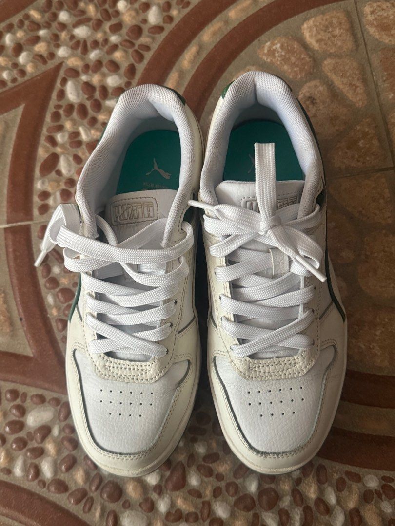 Original White Puma Sneakers Shoes (Category: Sneakers) located in Quezon City. Submitted by hoon777 (Listing ID 1404085504, Image 2). Description: Simple white sneaker with green details .