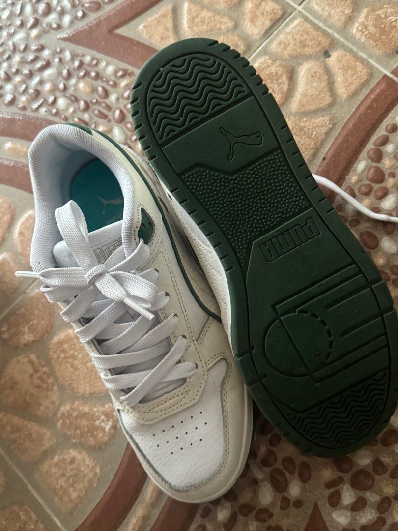 Original White Puma Sneakers Shoes (Category: Sneakers) located in Quezon City. Submitted by hoon777 (Listing ID 1404085504, Image 3). Description: Simple white sneaker with green details .
