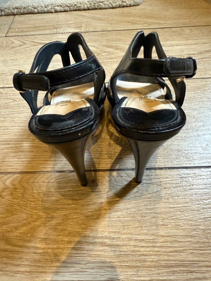 Prada Black Patent Leather Sandals (Category: Flats & Sandals) located in Taguig. Submitted by editroomph (Listing ID 1404000369, Image 3). Description: Elegant Prada sandals in black patent leather. Features a strappy design with a gold buckle closure. Size 36. Made in Italy. Gold-tone hardware. 100% authentic Shipping: c/o buyer Pick up Metro Manila.