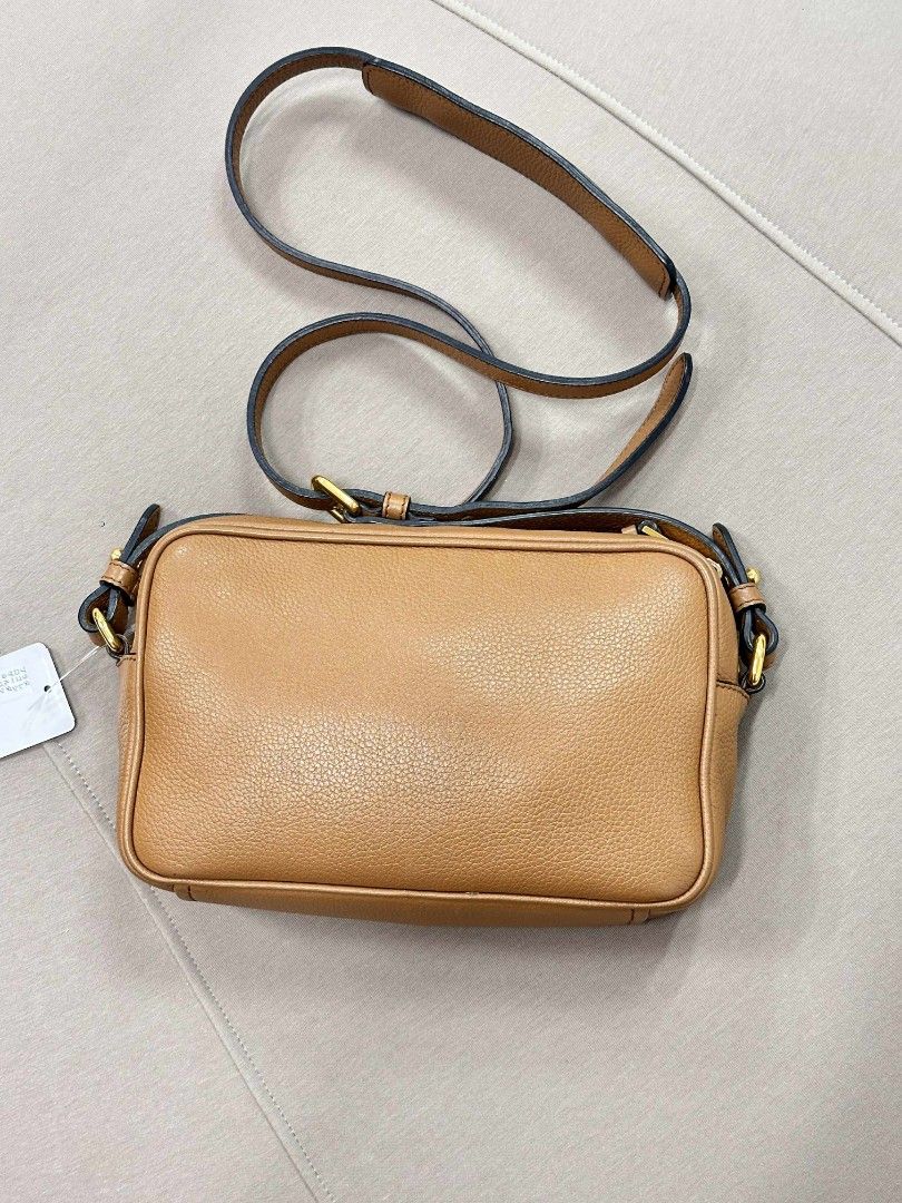 Prada Camera bag in leather (Category: Luxury Bags & Wallets) located in Passi. Submitted by janbelisario (Listing ID 1404047838, Image 2). Description: lighly used conditions Guaranteed original with dustbag and cards in brown leather yy.