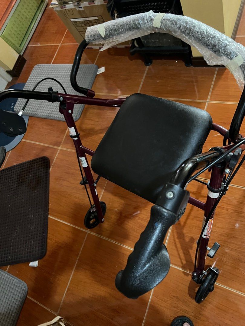 Rolling Walker with Seat without footrest (Category: Rehabilitative Devices) located in Las Pinas. Submitted by jerri44 (Listing ID 1404023514, Image 1). Description: - Rolling walker with seat and handles - Easy maneuverability with wheels - Dark red frame - Practical mobility aid.