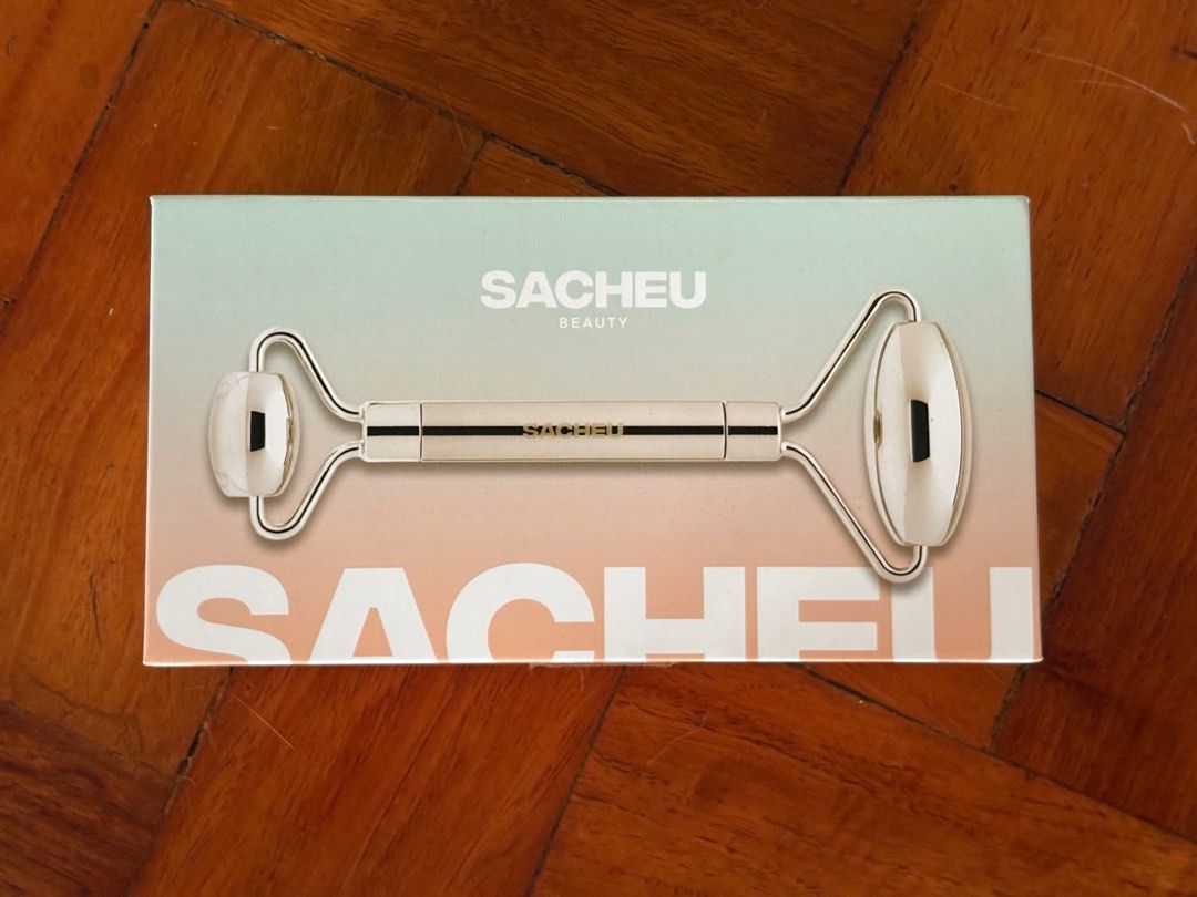 Sacheu Dual-Sided Beauty Roller (Category: Face Care) located in Quezon City. Submitted by mcpar9685821 (Listing ID 1404078299, Image 1). Description: •Never used •Priced at ₱2,100, selling for ₱1,800 (₱300 off) •Made of stainless steel, will last a lifetime •Also includes a travel pouch .