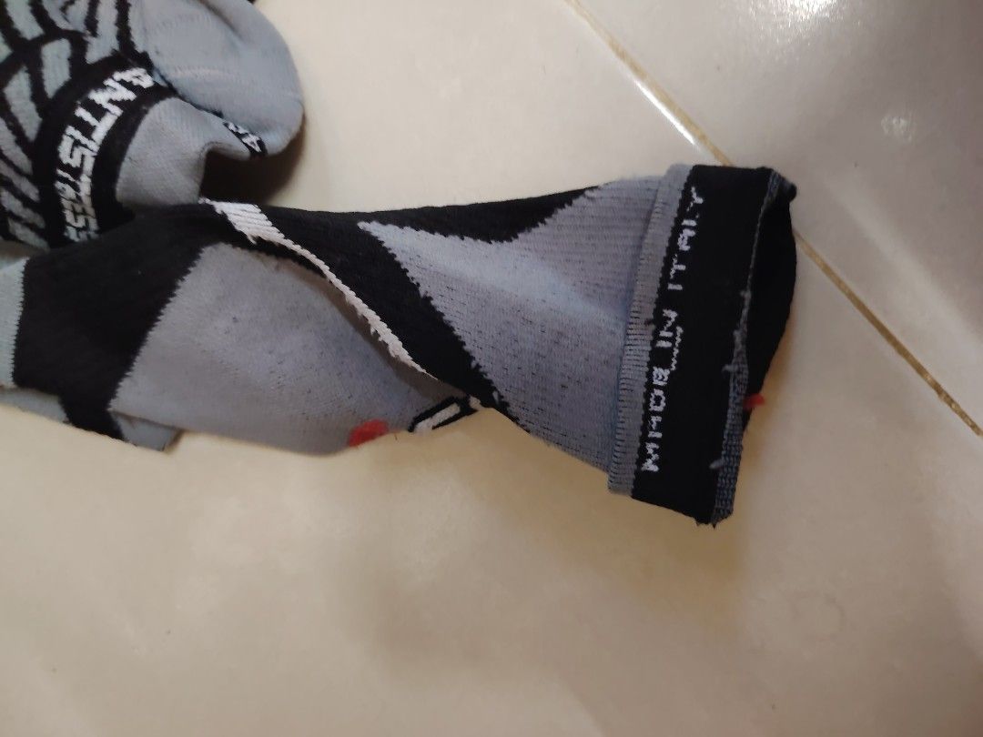Sarma Compression Socks (Category: Socks) located in Bachok. Submitted by jualmurahjanjihalal (Listing ID 1404020239, Image 2). Description: Pair of Sarma compression socks. Features an anti-stress design. Made in Italy. The socks have a grey and black color scheme with a geometric pattern. The socks have a compression design and are designed for athletic use..