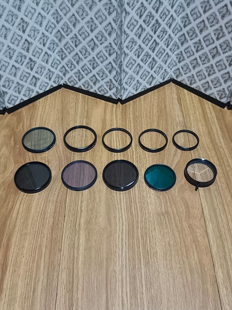 TAKE ALL ASSORTED CAMERA LENS FILTER (10 PCS) (Category: Cameras) located in Makati City. Submitted by nyxhemera26 (Listing ID 1404171183, Image 2). Description: - Assorted camera lens filters (10 pieces) - Includes Kenko and Marumi brands - Various types: PL, close-up, and more - Different sizes available - Some filters are still in their original packaging - Perfect for photography enthusiasts.