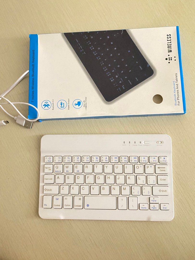 7-inch Wireless Bluetooth Keyboard for Phones and Tablets (Category: Computer Keyboard) located in Manila. Submitted by preownedbyprincess (Listing ID 1404200729, Image 1). Description: - Wireless Bluetooth keyboard - Compatible with phones and tablets - White keyboard with full keys - Bluetooth 3.0 connectivity - Includes charging cable - Compact and portable design.