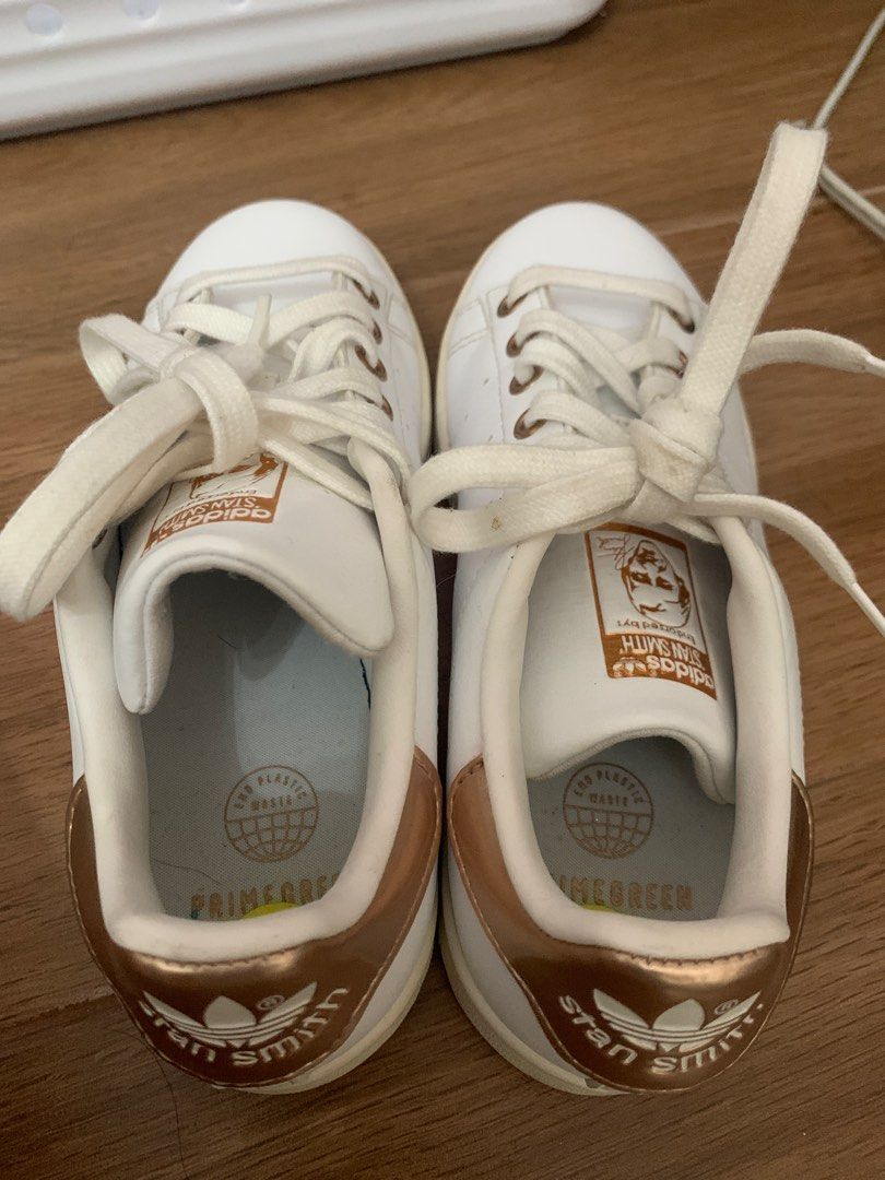Adidas Stan Smith White and Rose Gold (Category: Sneakers) located in Rizal. Submitted by bien_aime (Listing ID 1404199709, Image 1). Description: - Adidas Stan Smith shoes - White with rose gold accents - Stan Smith logo on tongue and heel - Classic design - Size 5.