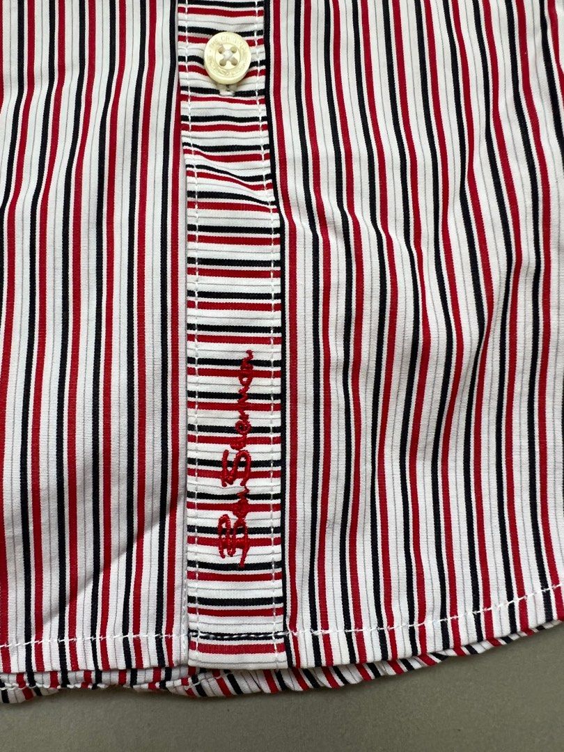 Ben Sherman Striped Shirt Age 3-4 (Category: Babies & Kids Fashion) located in Binan City. Submitted by finders_market (Listing ID 1404293228, Image 2). Description: Ben Sherman striped shirt for boys. Features a classic button-down design with a chest pocket. The shirt has a red, black, and white striped pattern. It is designed for children aged 3-4 years old. Made from 100% cotton..