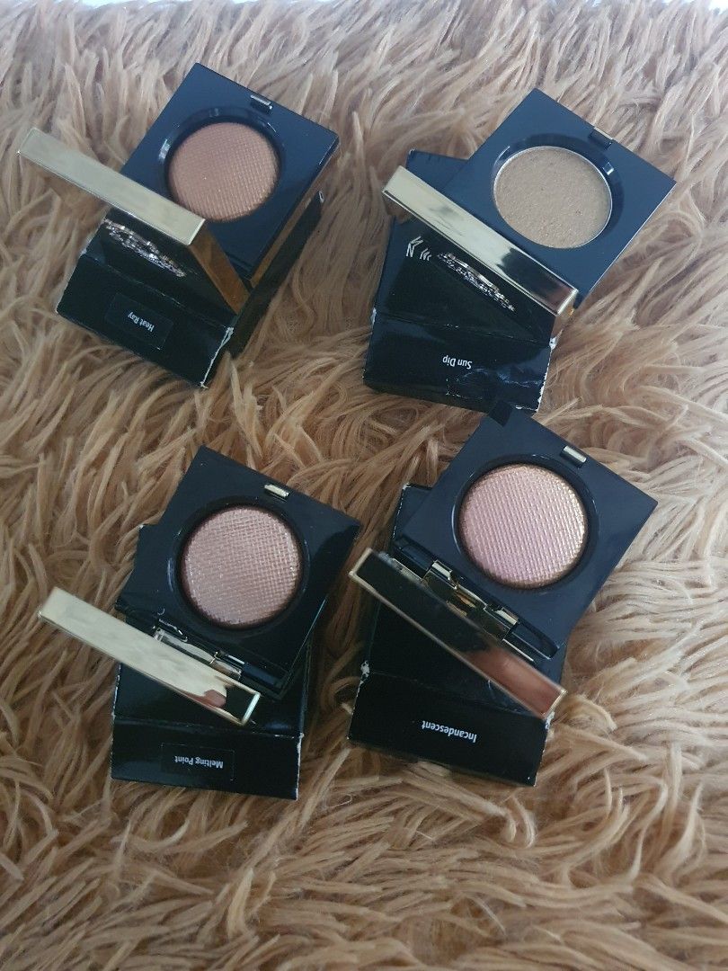 Bobbi Brown Luxe Eye Shadow Rich Metal (Category: Makeup) located in Pugo. Submitted by abshopfinity (Listing ID 1404315716, Image 2). Description: Bobbi Brown Luxe Eye Shadow in Rich Metal. The eyeshadows are in individual compacts with a mirror. The packaging is black with gold accents. The eyeshadows appear to be a shimmery, metallic finish. Several shades are visible, including bronze and pink tones. Each compact has the Bobbi Brown logo. 1,1