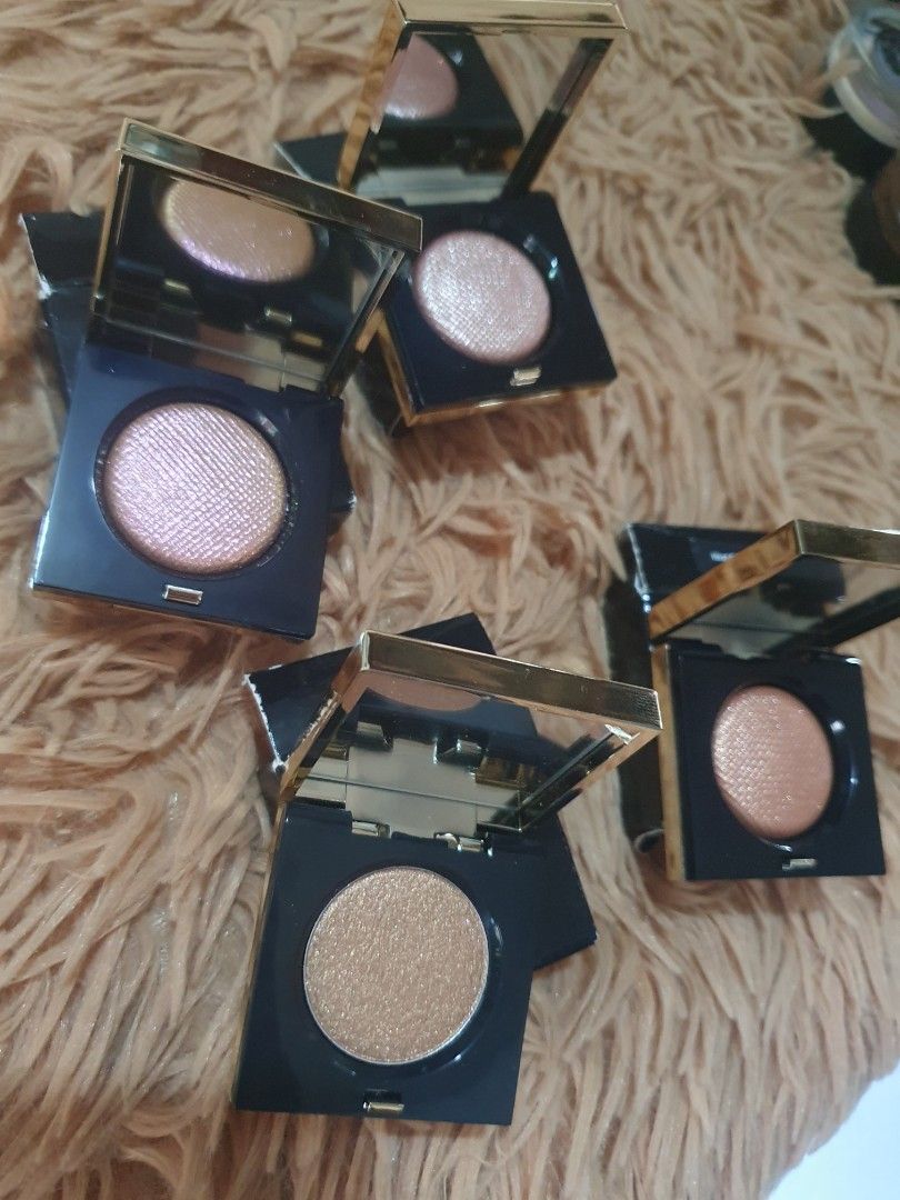 Bobbi Brown Luxe Eye Shadow Rich Metal (Category: Makeup) located in Pugo. Submitted by abshopfinity (Listing ID 1404315716, Image 3). Description: Bobbi Brown Luxe Eye Shadow in Rich Metal. The eyeshadows are in individual compacts with a mirror. The packaging is black with gold accents. The eyeshadows appear to be a shimmery, metallic finish. Several shades are visible, including bronze and pink tones. Each compact has the Bobbi Brown logo. 1,1