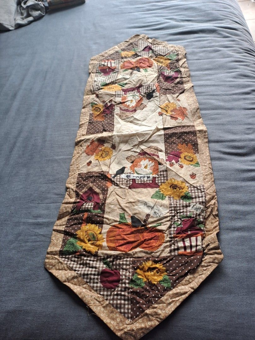 Brown and Floral Table Runner (Category: Table Linen & Textiles) located in Manila. Submitted by joanbalde39643 (Listing ID 1404221202, Image 3). Description: Table runner features a brown fabric with a unique shape. It also has a colorful floral design on the other side. Perfect for adding a touch of style to your dining table or any surface..