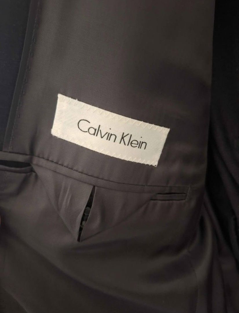 Calvin Klein Charcoal 2-Piece Suit (Category: Coats, Jackets and Outerwear) located in Marikina City. Submitted by mikeymikes (Listing ID 1404240610, Image 3). Description: - Calvin Klein 2-piece suit - Charcoal color - Jacket: 42 Regular - Pants: 35W - Material: 100% wool - Made in Indonesia - Original price: $625 - Open for swap. send your offers !!!! LAST PRICE FIRM !!!!.