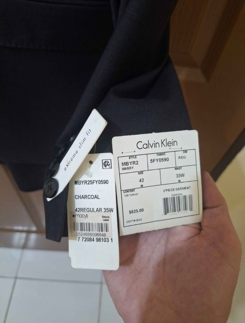 Calvin Klein Charcoal 2-Piece Suit (Category: Coats, Jackets and Outerwear) located in Marikina City. Submitted by mikeymikes (Listing ID 1404240610, Image 2). Description: - Calvin Klein 2-piece suit - Charcoal color - Jacket: 42 Regular - Pants: 35W - Material: 100% wool - Made in Indonesia - Original price: $625 - Open for swap. send your offers !!!! LAST PRICE FIRM !!!!.