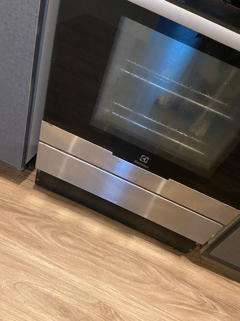 Electrolux range and hood (Category: Ovens & Toasters) located in Paranaque City. Submitted by pb.closet (Listing ID 1404198104, Image 1). Description: Electrolux range and oven. Features a fan and interior light. Includes a control panel with various settings. The oven door has a glass panel for easy viewing. The exterior is stainless steel. 90cm wide. Sold as a set with the range hood .