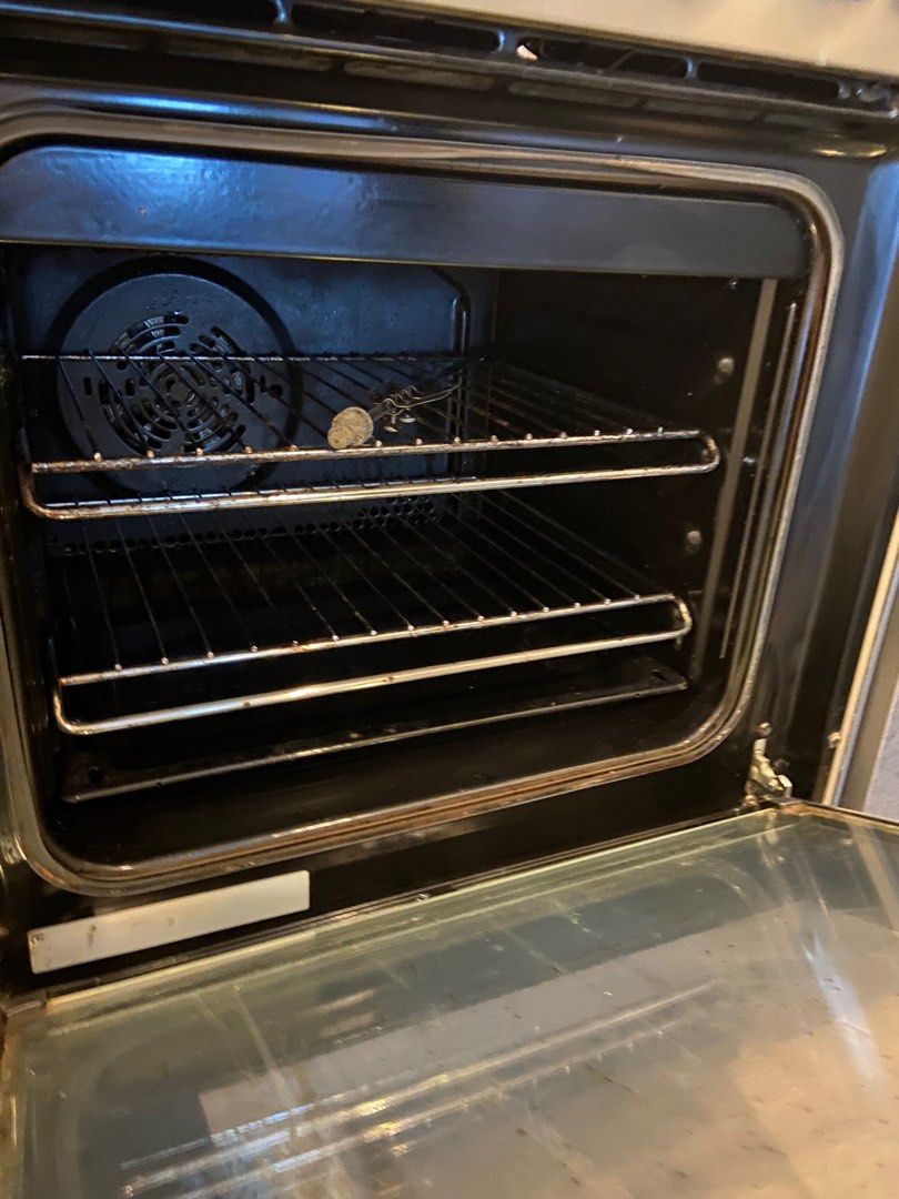 Electrolux range and hood (Category: Ovens & Toasters) located in Paranaque City. Submitted by pb.closet (Listing ID 1404198104, Image 2). Description: Electrolux range and oven. Features a fan and interior light. Includes a control panel with various settings. The oven door has a glass panel for easy viewing. The exterior is stainless steel. 90cm wide. Sold as a set with the range hood .