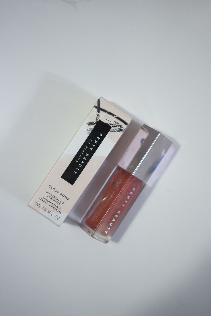 FENTY BEAUTY Gloss Bomb (Fenty Glow) (Category: Makeup) located in Quezon City. Submitted by jeanbacheng (Listing ID 1404349921, Image 1). Description: Shade: Fenty Glow Comes with original box Applicator visible in photos RFS: Almost never used. Casing only chipped from being in my makeup bag for quite some time 😅 Payment via BPI or Gcash Shipping c/o buyer if Grab or Lalamove Buy more free shipping via Flash/GGX/J&T.