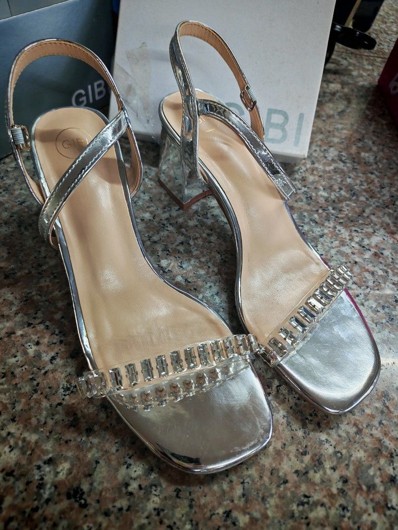 Gibi Silver Sandals with Embellishments (Category: Flats & Sandals) located in Manila. Submitted by declutter_sarah (Listing ID 1404263553, Image 2). Description: - Gibi silver sandals, size 35. - Square toe design. - Sparkling embellishments on straps. - Small block heel. - Adjustable ankle strap. - Comes with original box. -Tried on but never used outside Mop: BDO or Gcash Shipping c/o buyer. Grab or Lalamove No rush shipping pls - Includes ext