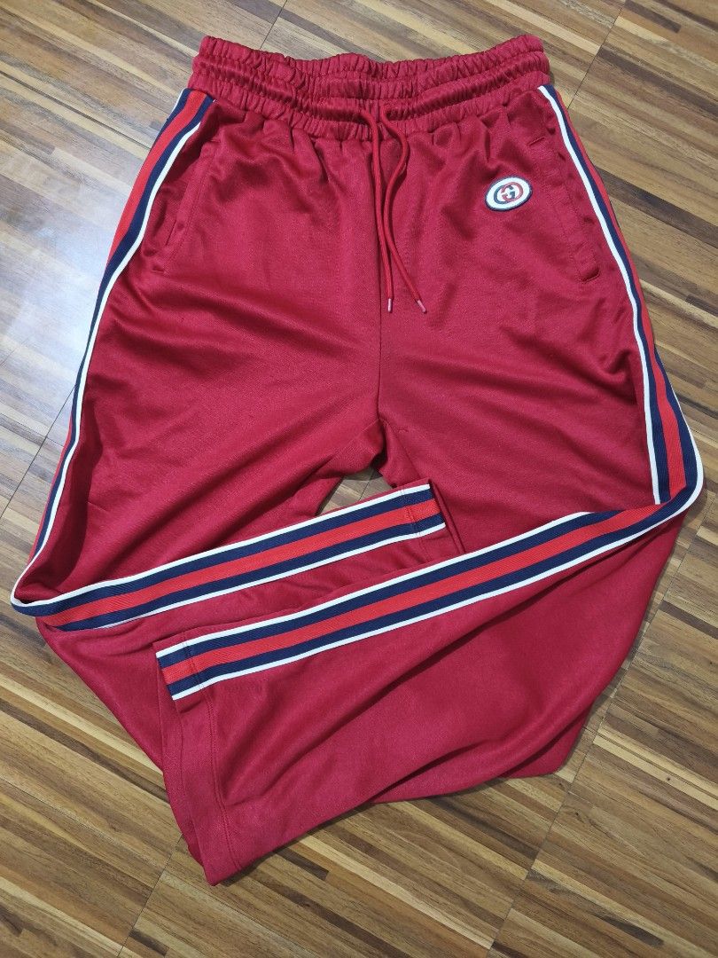 Gucci Red Track Pants (Category: Joggers) located in Taytay. Submitted by Rakeeeem (Listing ID 1404245969, Image 1). Description: For sale Gucci track pants Good condition Issue check pics, untag. 400 open for shipping, lalamove, cop thru lbc.