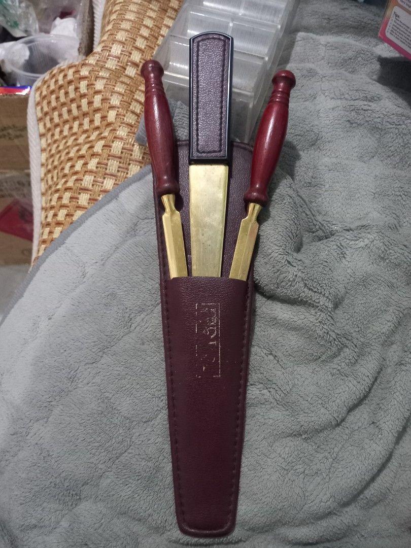 Leather Tool Set with Signature (Category: Construction Tools & Equipment) located in Subic. Submitted by regiegabriel29 (Listing ID 1404181311, Image 2). Description: - Includes two tools with wooden handles and brass components. - Features a rectangular tool. - Comes with a leather case for storage. - Leather case has a signature inside. - Well-maintained and ready for use..