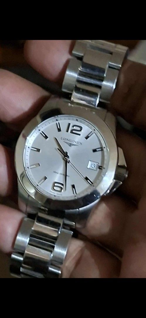 Longines HydroConquest Watch (Category: Luxury Watches) located in Cagayan de Oro. Submitted by purelion.ff7d09 (Listing ID 1404279059, Image 1). Description: Stainless steel Longines HydroConquest watch with a silver dial. Features a date display at the 3 o'clock position and luminous hands and markers. The watch has a stainless steel bracelet with a deployment clasp. The watch has a round case and a unidirectional rotating bezel..