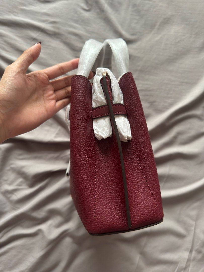 Michael Kors Mercer Small Top Handle Bag (Category: Luxury Bags & Wallets) located in Taguig. Submitted by mccdt (Listing ID 1404197881, Image 2). Description: - Michael Kors Mercer Small Top Handle Bag - Rich burgundy color - New and unused condition - Top handle and detachable strap - Zip closure - Interior pocket - Includes tag.