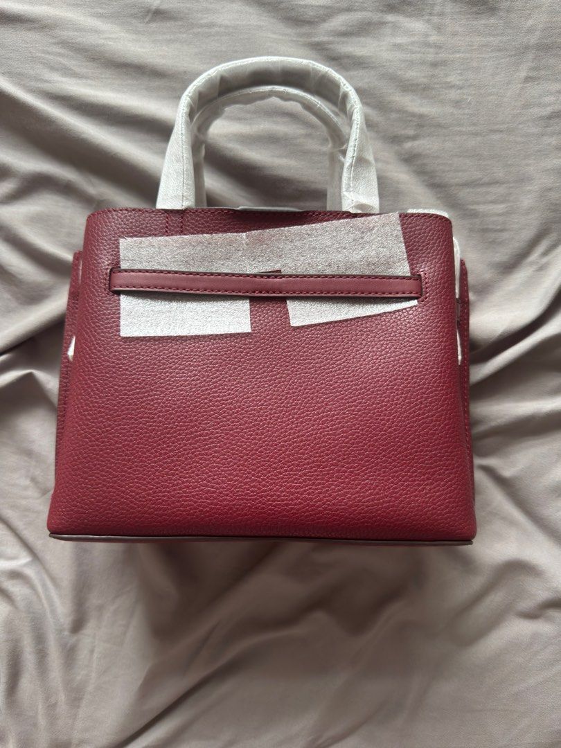 Michael Kors Mercer Small Top Handle Bag (Category: Luxury Bags & Wallets) located in Taguig. Submitted by mccdt (Listing ID 1404197881, Image 3). Description: - Michael Kors Mercer Small Top Handle Bag - Rich burgundy color - New and unused condition - Top handle and detachable strap - Zip closure - Interior pocket - Includes tag.