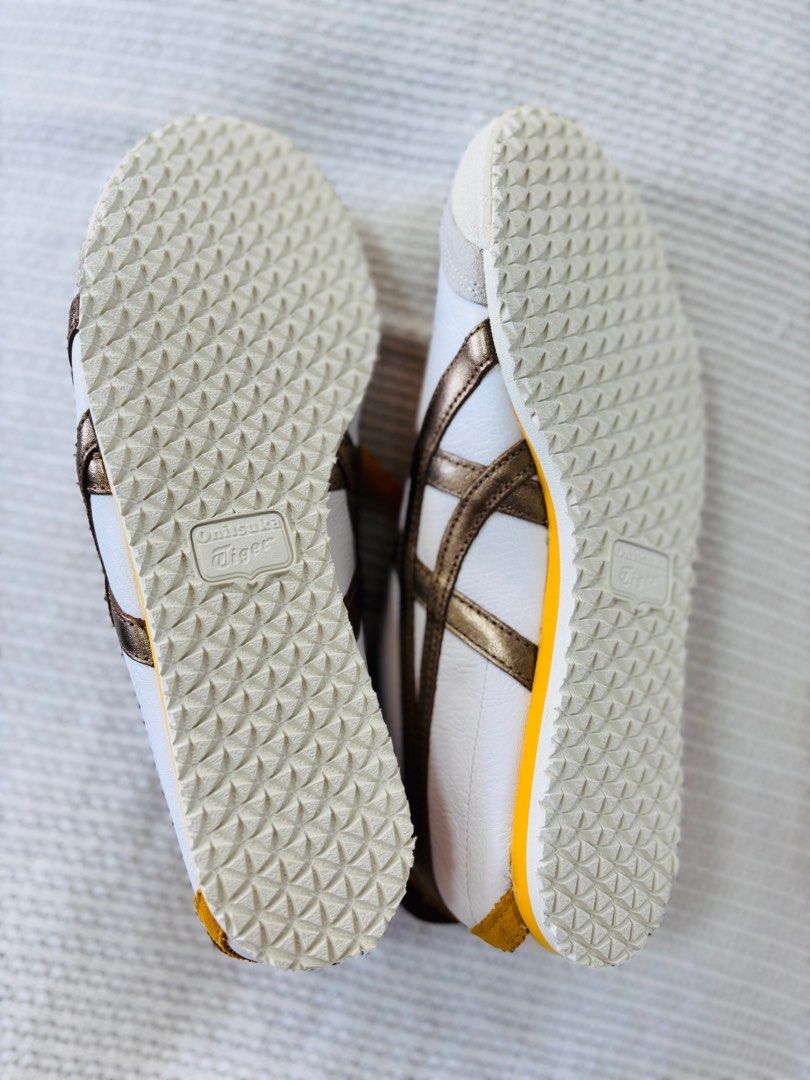 Onitsuka Tiger Mexico 66 - White/Gold (Category: Sneakers) located in Los Banos. Submitted by mommy_rizza (Listing ID 1404258843, Image 3). Description: Onitsuka Tiger Mexico 66 sneakers in white and gold. Features the iconic tiger stripes and a classic design. Includes original tags. Size 26.5. The shoes have yellow laces and a yellow insole. A stylish and comfortable choice for everyday wear. No box. .