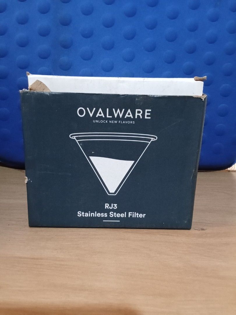 Ovalware RJ3 Stainless Steel Coffee Filter (Category: Coffee Machines & Makers) located in Bocaue. Submitted by marajapansurplus (Listing ID 1404209204, Image 3). Description: Ovalware RJ3 stainless steel coffee filter. It is a cone-shaped filter with a fine mesh design. The filter comes with its original box. The box features the Ovalware logo and product information. The filter is designed for brewing coffee and is made of stainless steel. Box 