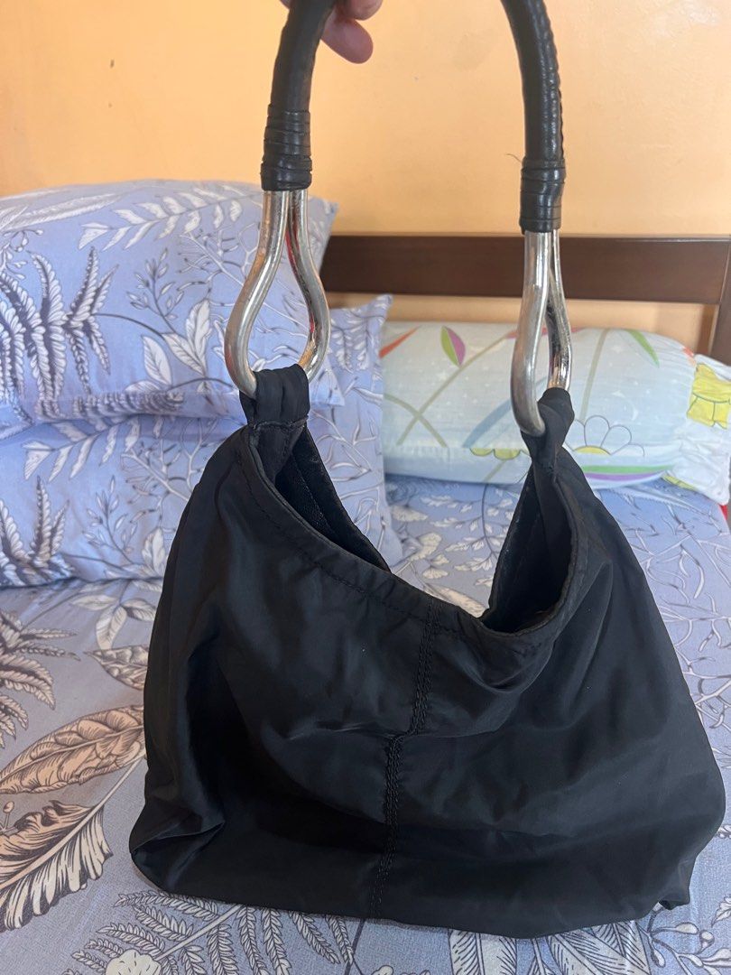 Prada Hobo Bag (Category: Luxury Bags & Wallets) located in Manila. Submitted by beatep (Listing ID 1404262733, Image 2). Description: Prada hobo bag Black nylon tessuto See actual pics for details Shipping ti be shouldered by the buyer.
