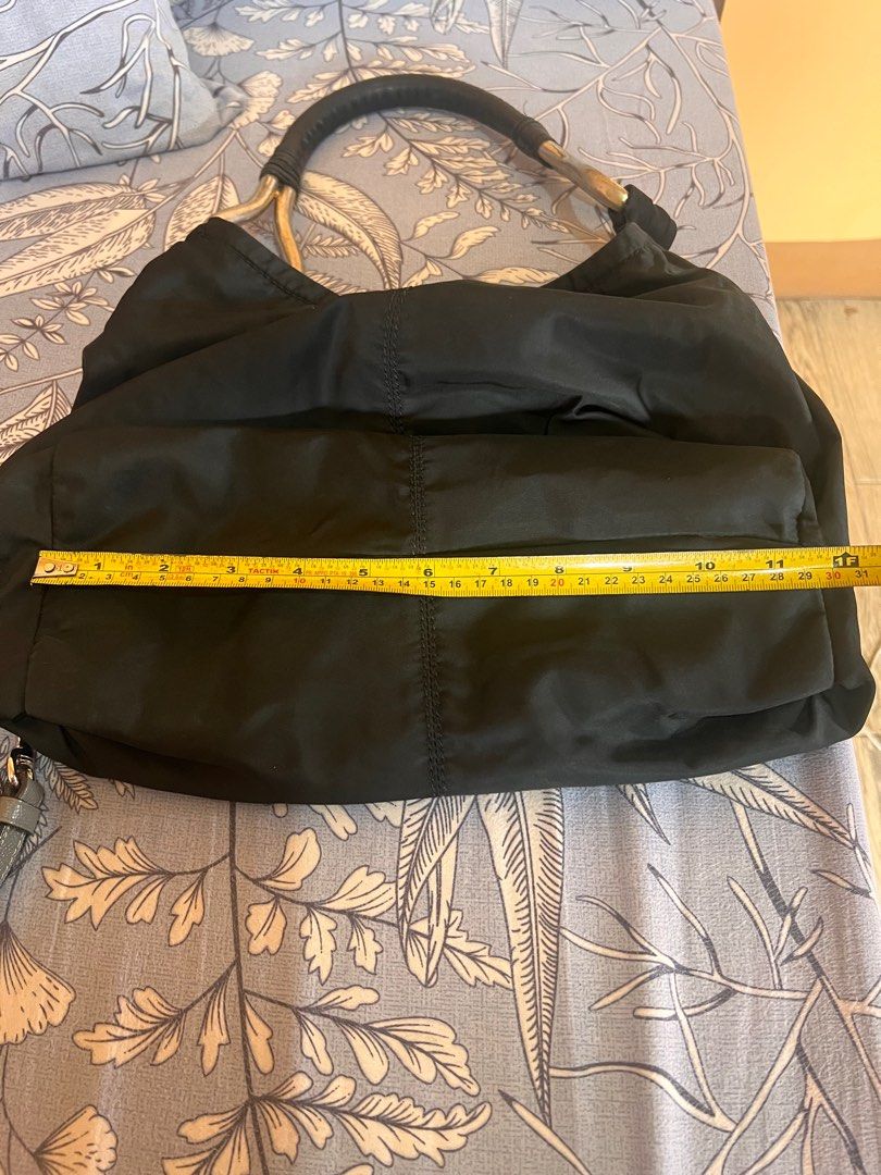 Prada Hobo Bag (Category: Luxury Bags & Wallets) located in Manila. Submitted by beatep (Listing ID 1404262733, Image 3). Description: Prada hobo bag Black nylon tessuto See actual pics for details Shipping ti be shouldered by the buyer.
