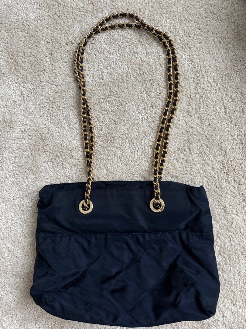 Prada Nylon Chain Bag (Category: Luxury Bags & Wallets) located in Manila. Submitted by jazzzzz06 (Listing ID 1404211776, Image 2). Description: - Authentic Prada Shoulder bag -with authenticity card - Navy Blue (near black) nylon material - Elegant gold-tone chain straps -dust bag included - Stylish quilted design - Secure zipper closure .