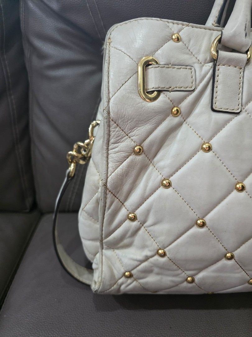 Preloved Michael Kors Hamilton Bag (Category: Luxury Bags & Wallets) located in Paranaque City. Submitted by jillzv (Listing ID 1404229562, Image 3). Description: Preloved Michael Kors Hamilton Bag -With Gold Studs and Hardware -Multi-pocket and zip compartments -As is where is. RFS: Decluttering. Shipping care of buyer. .
