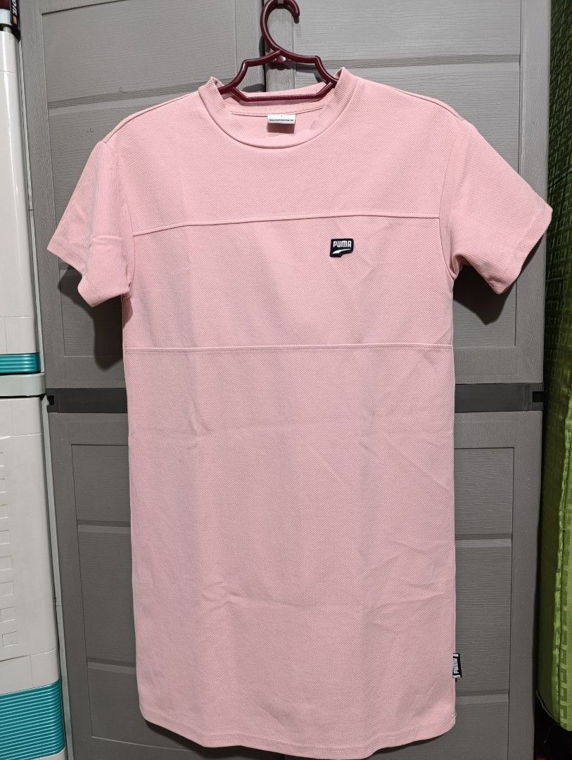 Puma Pink T-shirt - Size S (Category: Dresses) located in Manila. Submitted by avicmbe (Listing ID 1404231693, Image 1). Description: Pink Puma T-shirt. Features a small Puma logo on the chest and a Puma tag on the side. The shirt has a crew neck and short sleeves. The size is S (Asia). Made in China..