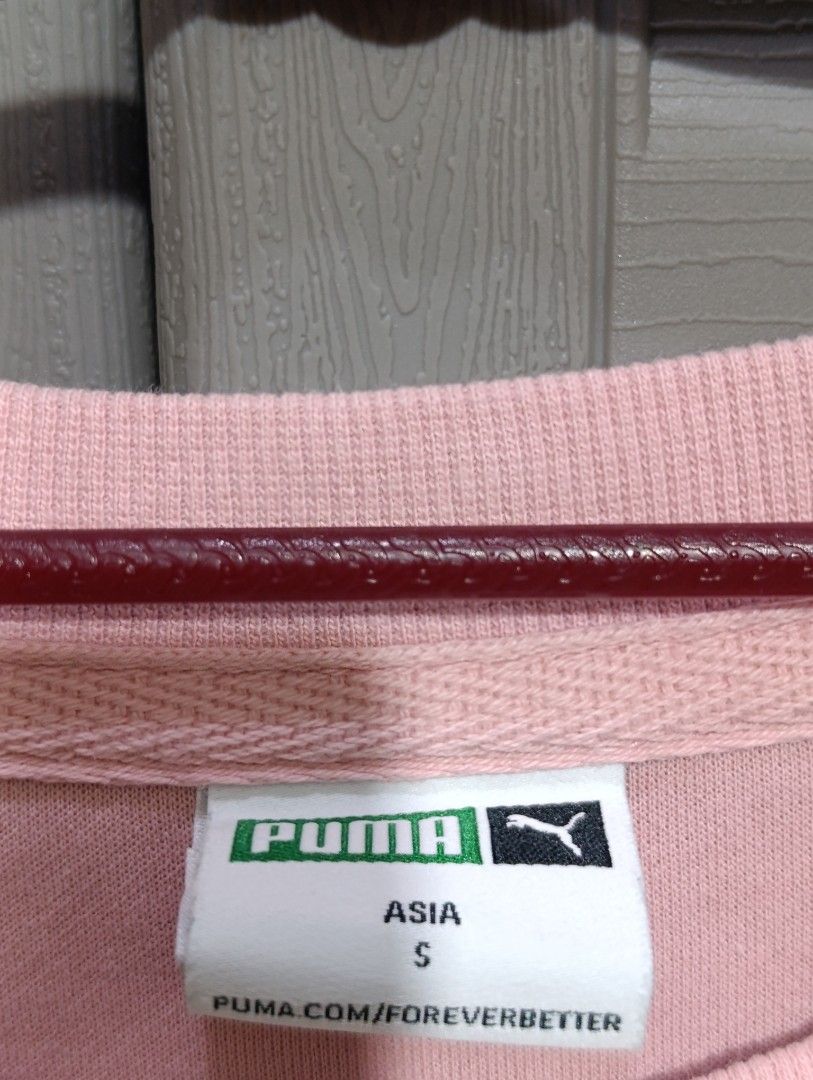 Puma Pink T-shirt - Size S (Category: Dresses) located in Manila. Submitted by avicmbe (Listing ID 1404231693, Image 2). Description: Pink Puma T-shirt. Features a small Puma logo on the chest and a Puma tag on the side. The shirt has a crew neck and short sleeves. The size is S (Asia). Made in China..