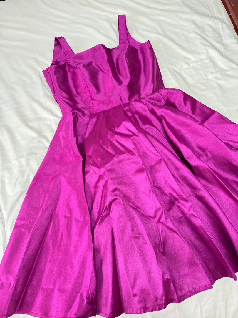 Purple Satin Dress (Category: Dresses) located in Cavite. Submitted by luisascloset_ (Listing ID 1404321025, Image 2). Description: - Stunning purple satin midi dress - Square neckline - Flared skirt - Fitted bodice - Sleeveless design - Back zipper closure - With Ribbon at the back pls see inspo photod - Ideal for special events -It was custom made but i wasnt able to use since sabi ko simple lang but my designer wasnt able to comprehend, magmuk