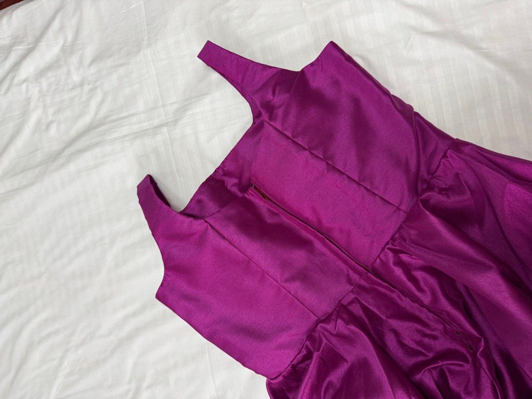Purple Satin Dress (Category: Dresses) located in Cavite. Submitted by luisascloset_ (Listing ID 1404321025, Image 3). Description: - Stunning purple satin midi dress - Square neckline - Flared skirt - Fitted bodice - Sleeveless design - Back zipper closure - With Ribbon at the back pls see inspo photod - Ideal for special events -It was custom made but i wasnt able to use since sabi ko simple lang but my designer wasnt able to comprehend, magmuk