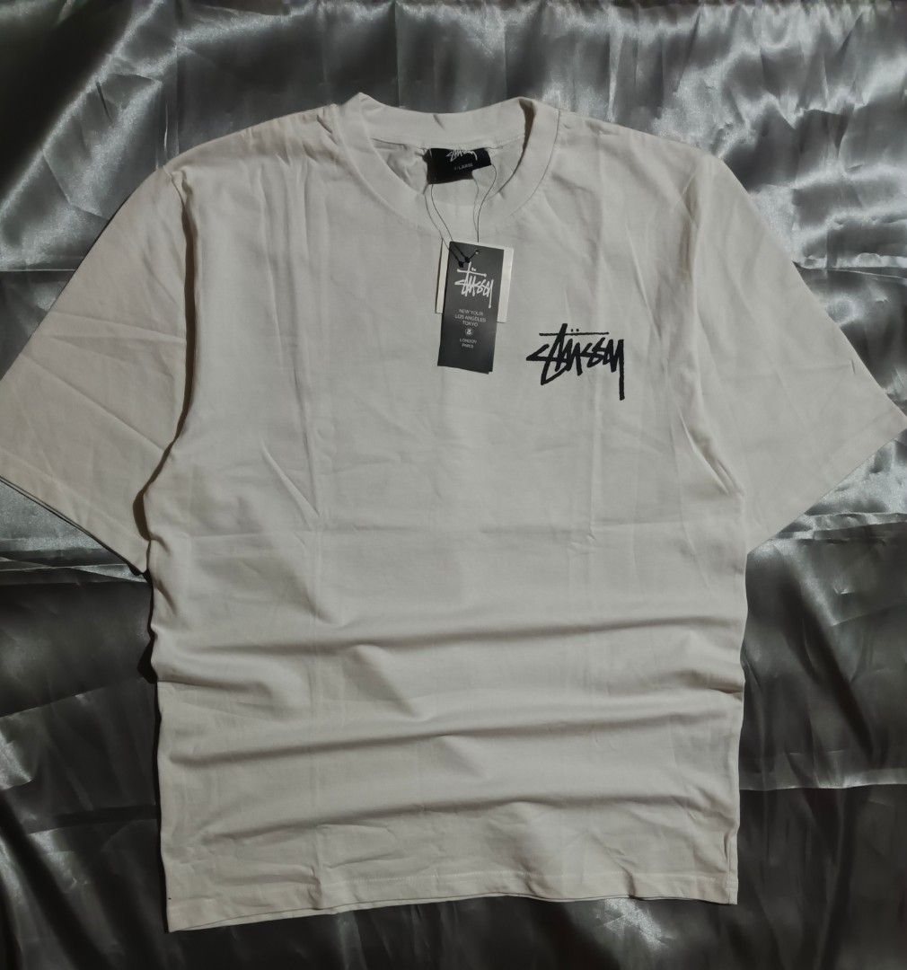 Stussy Dice Tee (Category: Tshirts & Polo Shirts ) located in Taguig. Submitted by marked_item (Listing ID 1404276649, Image 1). Description: - Stussy t-shirt - Cream color - Small logo on front - Dice graphic on back - Tag attached - Size xl.