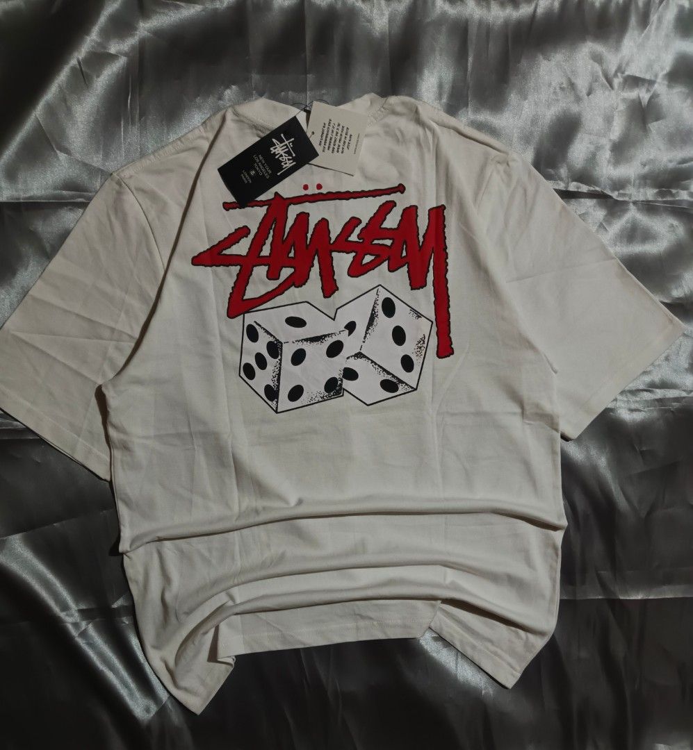 Stussy Dice Tee (Category: Tshirts & Polo Shirts ) located in Taguig. Submitted by marked_item (Listing ID 1404276649, Image 2). Description: - Stussy t-shirt - Cream color - Small logo on front - Dice graphic on back - Tag attached - Size xl.
