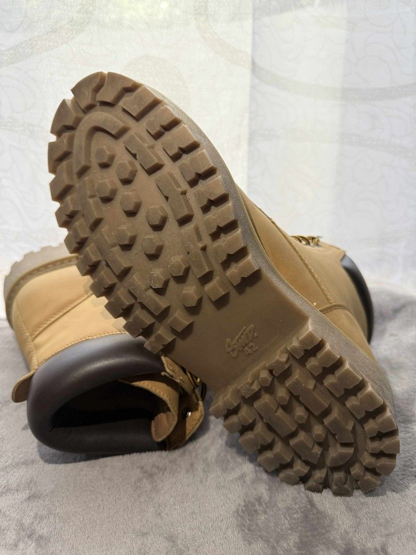 STWD Lace-up Boots (Category: Boots) located in Manila. Submitted by sparkplug2002 (Listing ID 1404255754, Image 2). Description: - STWD lace-up boots - Tan suede-like upper - Brown sole - Lace-up closure with metal eyelets - Padded collar - Chunky sole for grip and style - Brown heel cap lightly used shipping is paid by buyer LBC or J&t.