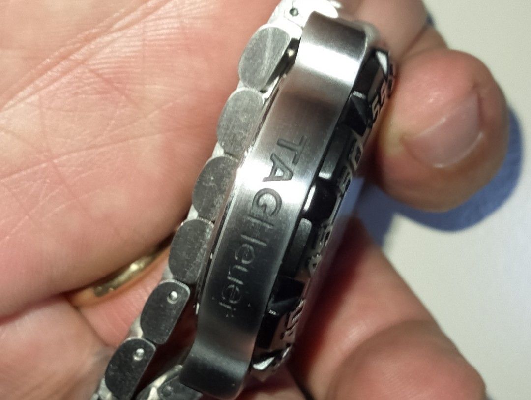 Tag Heuer Formula 1 200M Professional Watch (Category: Men's Watches) located in Quezon City. Submitted by jonathan_ilog18 (Listing ID 1404312994, Image 3). Description: - Tag Heuer Formula 1 watch - Black dial with luminous markers and hands - Stainless steel bracelet - Rotating bezel - Water-resistant to 200 meters - Date display at 3 o'clock - Folding clasp.