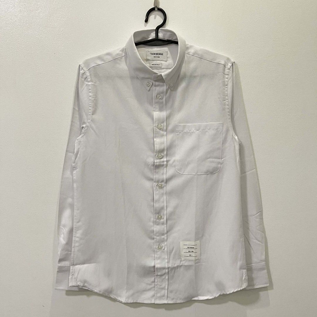 THOM BROWNE BUTTON DOWN SHIRT (Category: Luxury Apparel) located in Bacolod City. Submitted by the.finest (Listing ID 1404352407, Image 1). Description: Thom Browne Button Down Shirt Tag size: 1 Width: Length: Condition: 9.5/10 2,650+shipping fee.