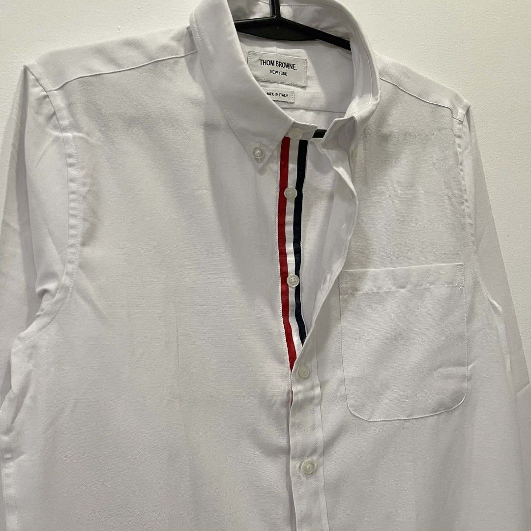 THOM BROWNE BUTTON DOWN SHIRT (Category: Luxury Apparel) located in Bacolod City. Submitted by the.finest (Listing ID 1404352407, Image 3). Description: Thom Browne Button Down Shirt Tag size: 1 Width: Length: Condition: 9.5/10 2,650+shipping fee.