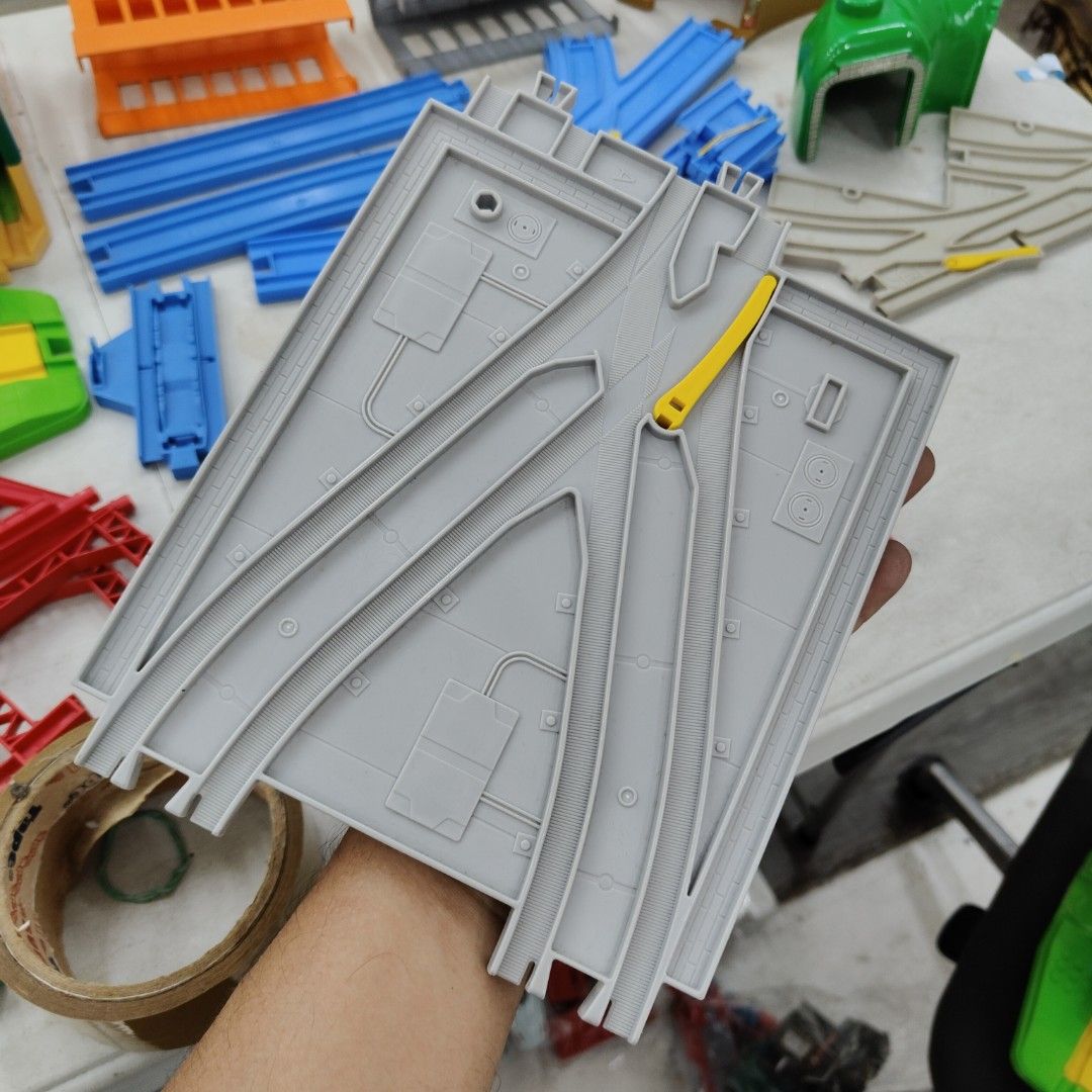 Tomy Plarail Train Track Set (Category: Action & Battle Toys) located in Manila. Submitted by rossinicalabig (Listing ID 1404182840, Image 3). Description: Starts at 10-400 Pesos each Assorted spare parts of Tomy Plarail train tracks and accessories. Includes various track pieces, bridges, stations, a tunnel, and other components. Features a variety of colors and track configurations. Made in Thailand. Perfect for expanding your existing Plarail 