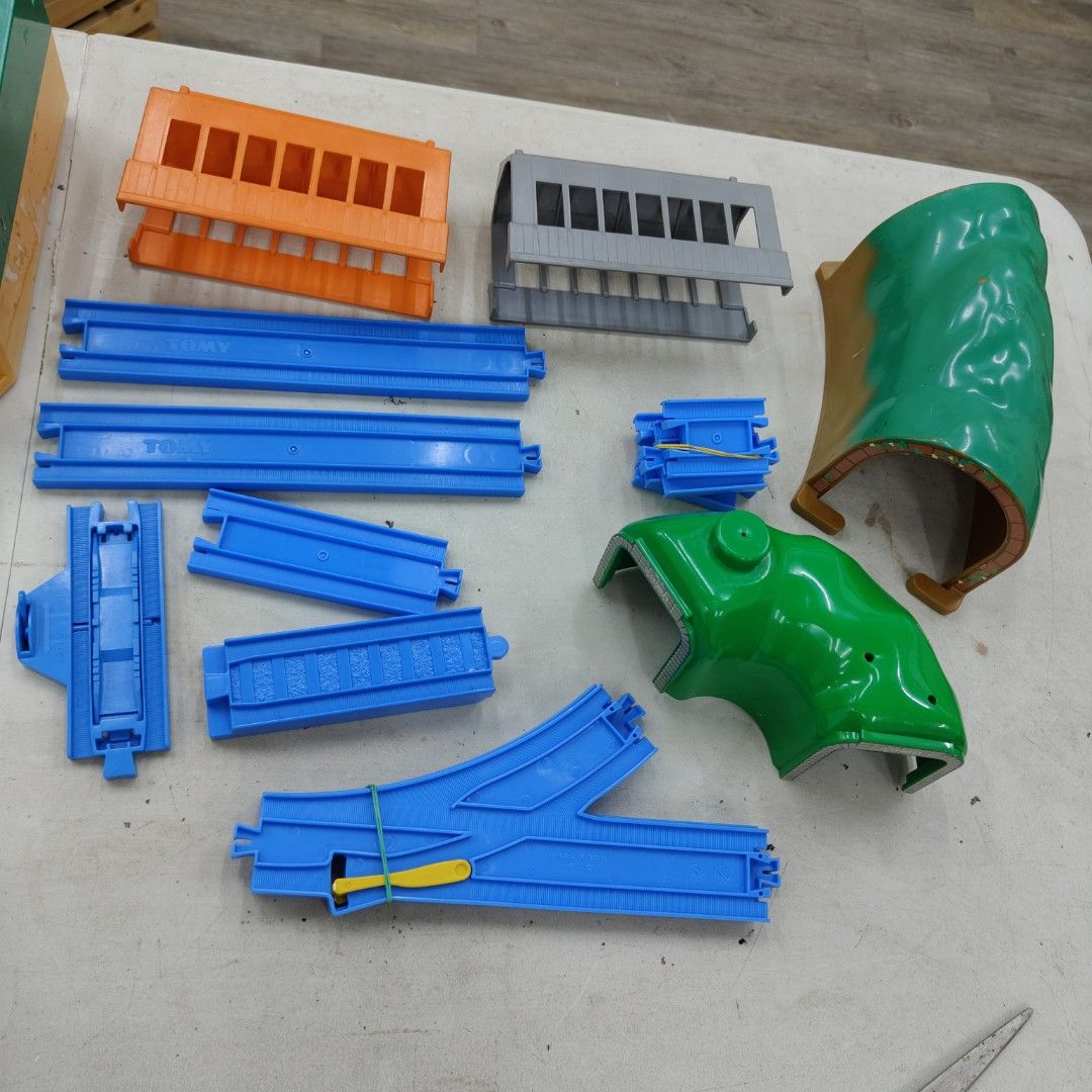 Tomy Plarail Train Track Set (Category: Action & Battle Toys) located in Manila. Submitted by rossinicalabig (Listing ID 1404182840, Image 2). Description: Starts at 10-400 Pesos each Assorted spare parts of Tomy Plarail train tracks and accessories. Includes various track pieces, bridges, stations, a tunnel, and other components. Features a variety of colors and track configurations. Made in Thailand. Perfect for expanding your existing Plarail 