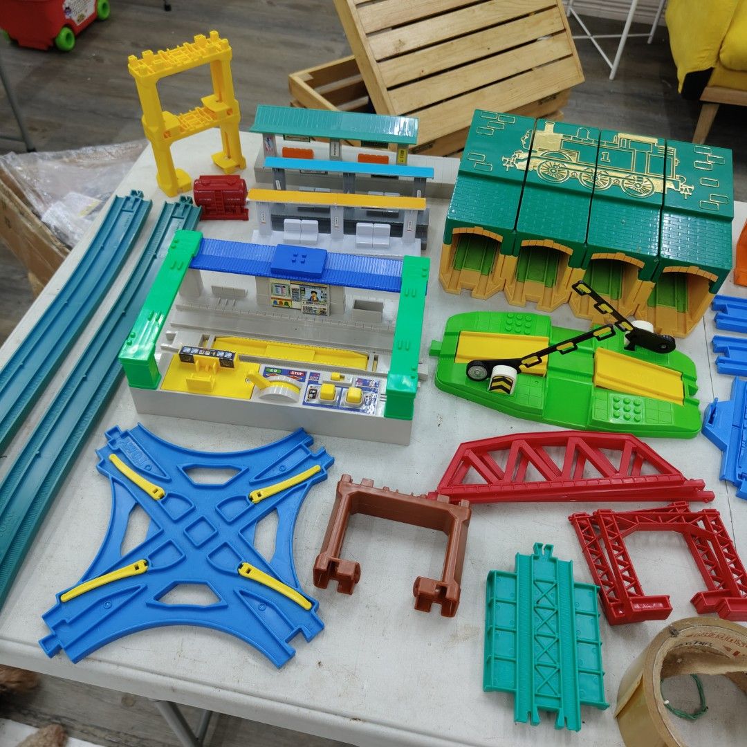 Tomy Plarail Train Track Set (Category: Action & Battle Toys) located in Manila. Submitted by rossinicalabig (Listing ID 1404182840, Image 1). Description: Starts at 10-400 Pesos each Assorted spare parts of Tomy Plarail train tracks and accessories. Includes various track pieces, bridges, stations, a tunnel, and other components. Features a variety of colors and track configurations. Made in Thailand. Perfect for expanding your existing Plarail 