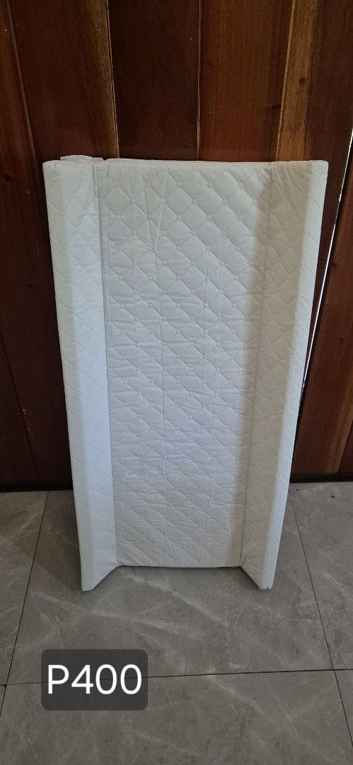 White Changing Pad (Category: Changing Mats & Accessories) located in Quezon City. Submitted by shopus2mnl (Listing ID 1404252913, Image 1). Description: - White changing pad - Quilted surface - Raised sides for safety - Soft, padded material - Price: P400.