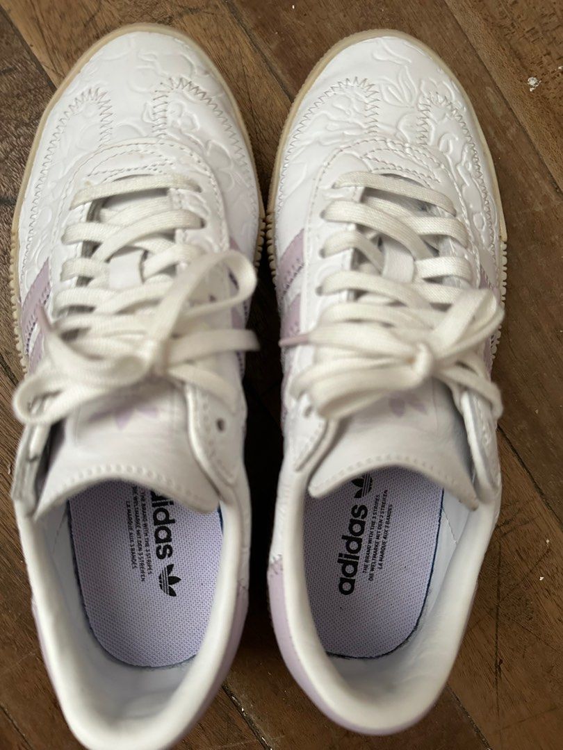 Adidas for women (Category: Sneakers) located in Antipolo. Submitted by decluttertosave (Listing ID 1404413774, Image 2). Description: - Adidas - White with floral pattern - Light purple three stripes - Platform sole - Adidas logo on insole - Size US 6 - Made in Vietnam.