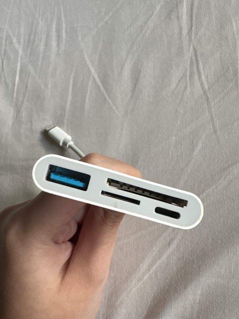 Apple Lightning 4in1 Card Reader (Category: Cables & Adaptors) located in Quezon City. Submitted by aml49_ (Listing ID 1404421487, Image 3). Description: Used for reading my camera’s SD Card RFS: changed to a phone with usb-c.